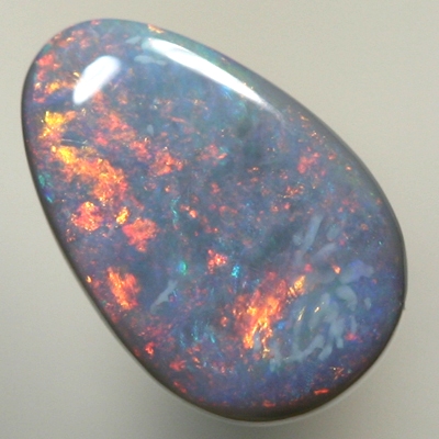 SOLID SEMI BLACK OPAL Fire red and copper orange sweeps over the opal